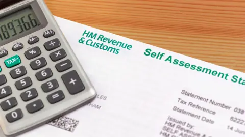 Getty Images end of year working out inland revenue tax self assessment form with calculator