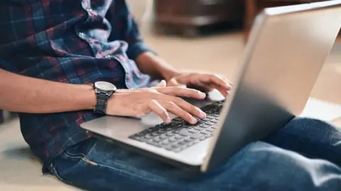 Getty Images Man using laptop