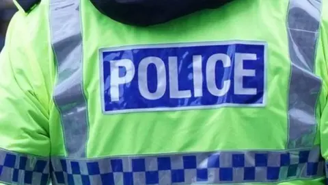 PA Media Police officers at crime scene