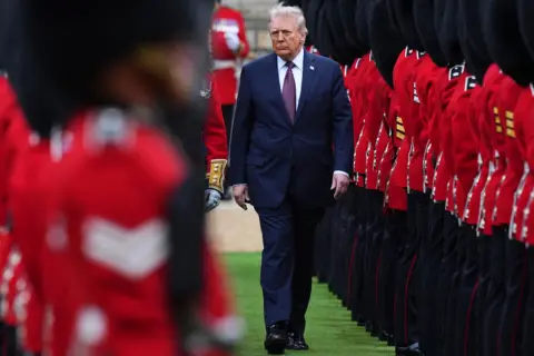 Kirsty Wigglesworth/WPA Pool/Getty Images US President Donald Trump reviews the Guard of Honour after his arrival at Windsor Castle 