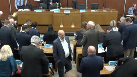 The councillors leaving the chamber