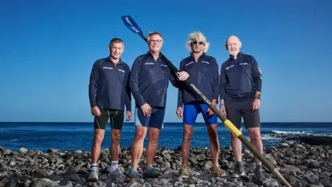 Atlantic Campaigns Four men standing on a beach