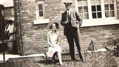 David Bambrough Mary sitting next to a man