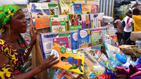AFP A woman selling French second-hand books in Abidjan, Ivory Coast