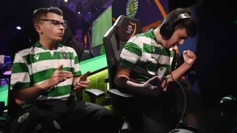 Getty Images Two players from Portuguese football club Sporting's e-sports team