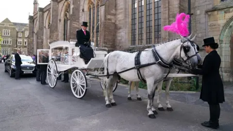 PA Media Horse-drawn carriage arrives at church