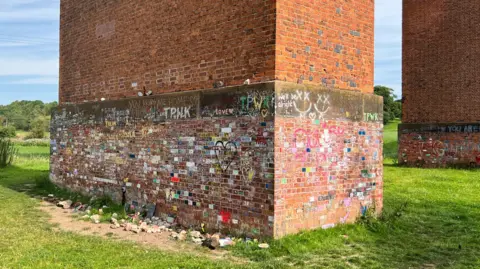 Network Rail The brickwork of Twemlow Viaduct daubed in brightly coloured graffiti  