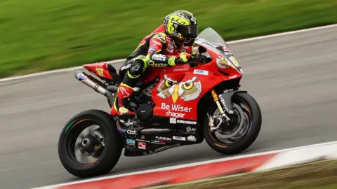 Getty Images Shane "Shakey" Byrne of the Be Wiser Ducati Racing Team rides during practice for round two of the British Superbike Championship at Brands Hatch
