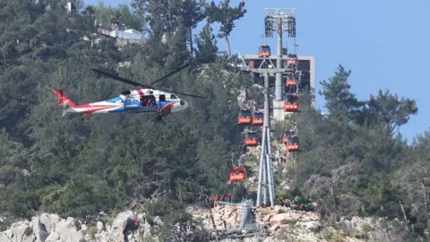 Getty Images Throughout Saturday, search and rescue operations continued for the people trapped in the cabins at the Tunektepe Cable Car Facility, Konyaalti district in Antalya