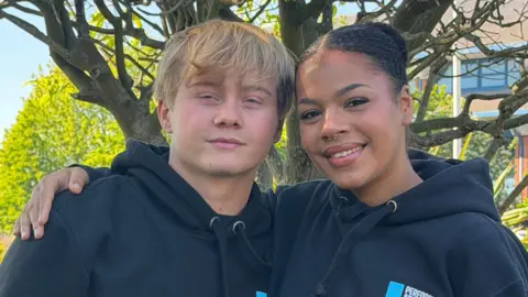 LMA University Two young people smiling wearing hoodies, Michael and Rose.