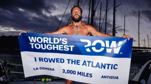 World's Toughest Row Elliot Awin after finishing the challenge