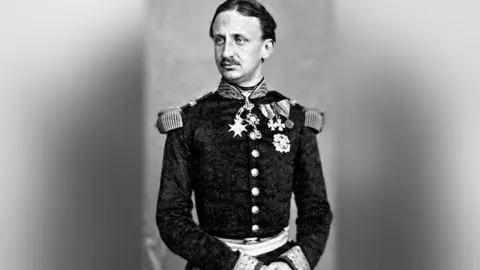 Public Domain Black and white photo of man with short dark hair and moustache wearing military uniform