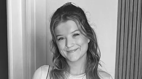 Family handout Smiling Demi-Leigh Davies, wearing her hair long, in a black and white photo released by her family
