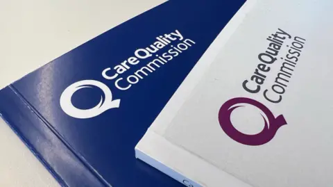 CQC One purple booklet displays the logo of the Care Quality Commission. Another white booklet overlaps the book with the same logo
