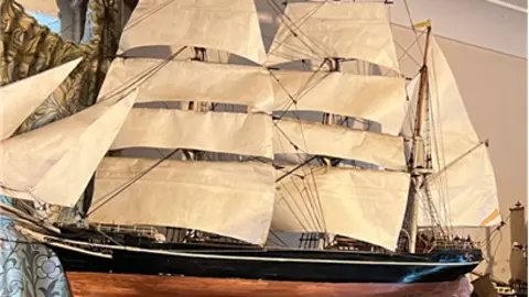 A large model sailing boat.