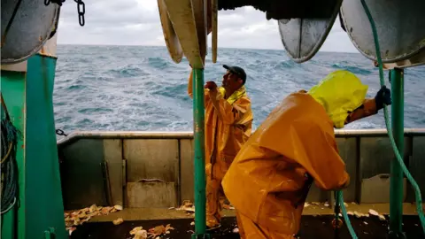 Reuters French fishermen aboard their vessel