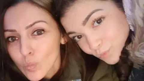 PSNI Giselle Marimon-Herrera and her daughter Allison