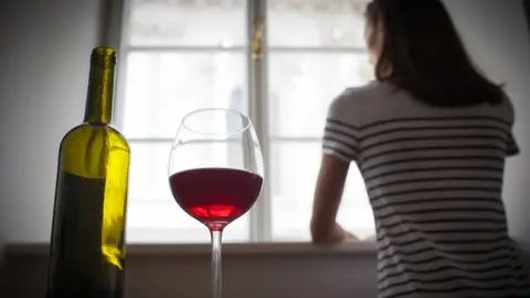 Getty Images Woman with an alcohol problem