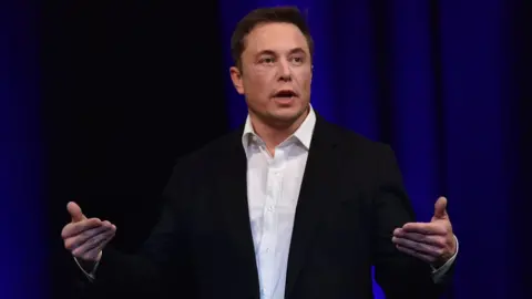 AFP/Getty Images File photo dated 29 September 2017 shows billionaire entrepreneur and founder of SpaceX Elon Musk speaking at the 68th International Astronautical Congress 2017 in Adelaide.