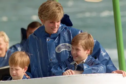 PA Media Diana, Princess of Wales, with her sons, Princes Harry (left) and William, aboard the Maid of the Mist cruiser near to Niagara Falls