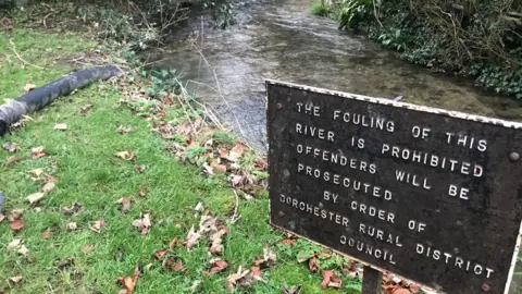 Trevor Bevins Sign at river