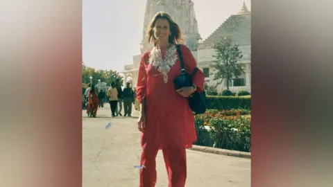 Ann Cooper Ann is wearing a red salwar kameez in Hyderbad, during one of her visits to India.