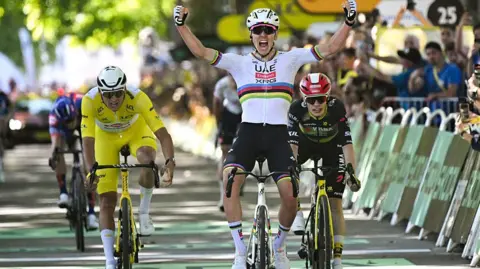 Tadej Pogacar celebrates winnning stage four