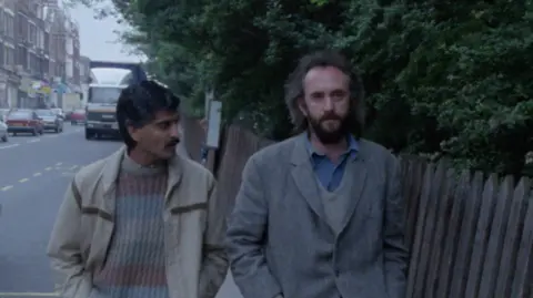 Remake Collective/BFI A screenshot of the young Jonathan Pryce who plays an Irish rough sleeper who drifts around London.