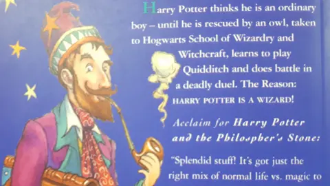 Richard Winterton The back cover of Harry Potter and the Philosopher's Stone. A wizard is smoking a pipe and there is a spelling mistake in the blurb. 