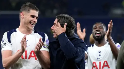 Tottenham celebrate their win over Everton