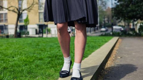 Stock photo of a young woman wearing a skirt