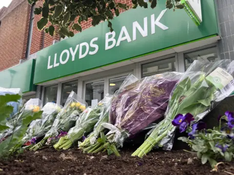 Flowers outside a bank