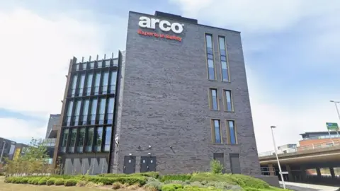 Arco's Blackfriargate building. It is a large modern-looking building. The sky is blue.