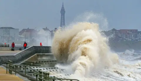 PA/Peter Byrne Waves crashing on the seafront at Blackpool ahead of Storm Dudley