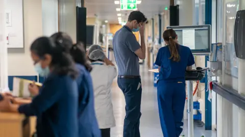 PA Media General view of staff on a NHS hospital ward.