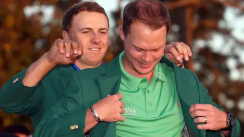 Getty Images Danny Willett dons a green jacket after winning the wins the 2016 Masters