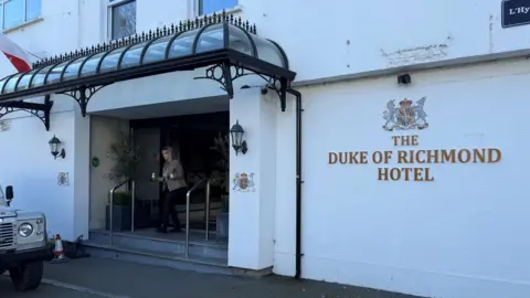 BBC The front door and sign of the Duke of Richmond hotel in St. Peter Port
