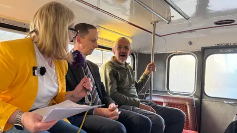 Sophie Law quizzes Graham MacDonald as Luke Marion watches on.