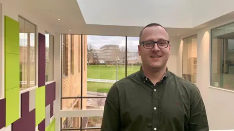 A man stood on a gantry in the BBC Radio Leicester building