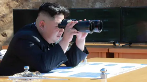 KCNA/REUTERS North Korean Leader Kim Jong Un looks on during the test-fire of inter-continental ballistic missile Hwasong-14 in this undated photo released by North Korea's Korean Central News Agency