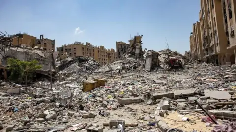 EPA A view of damage after the withdrawal of Israeli forces from Hamad City in Khan Yunis, southern Gaza Strip, 24 August 2024.