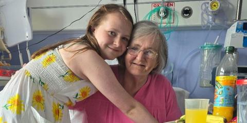 Maisy hugging her grandmother in hospital