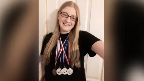 KAtie Mahers Katie Mahers with the medals she has won for Phoenix Swimming Club for Disabled