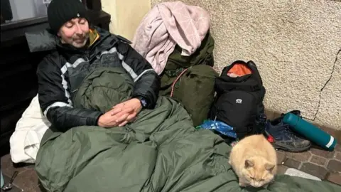 Cosmo the cat's adventures Neil Allcote sleeping rough with Cosmo the cat