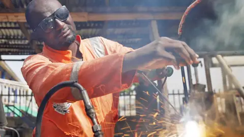 BBC Kabir Abu Bilal welding at his workshop in Zaria, Nigeria - December 2023