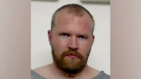 Police Scotland Police mugshot of Aren Pearson looking at camera.