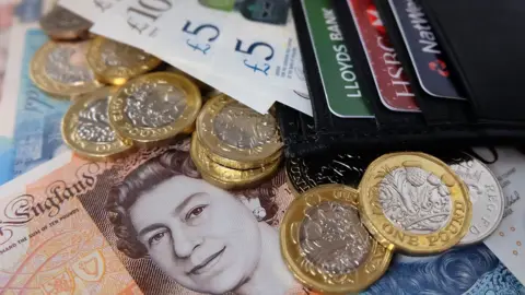 Getty Images Cash and cards