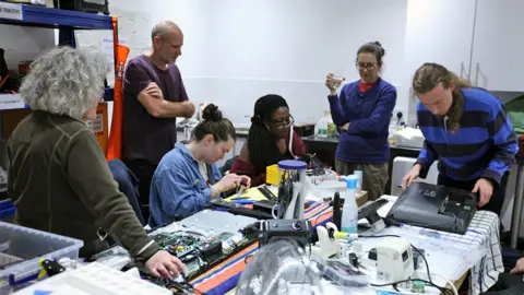 BBC Volunteers repair electrical items at the Fixing Factory in Camden, London