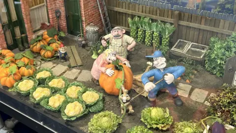 BBC Puppets gardening in a Wallace & Gromit Scene