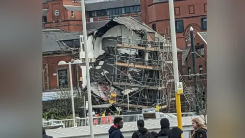 Kwok Wong Building collapsing as people watch on